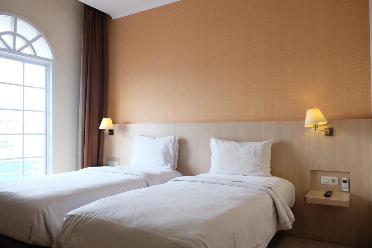 Rio City Hotel Palembang Extérieur photo
